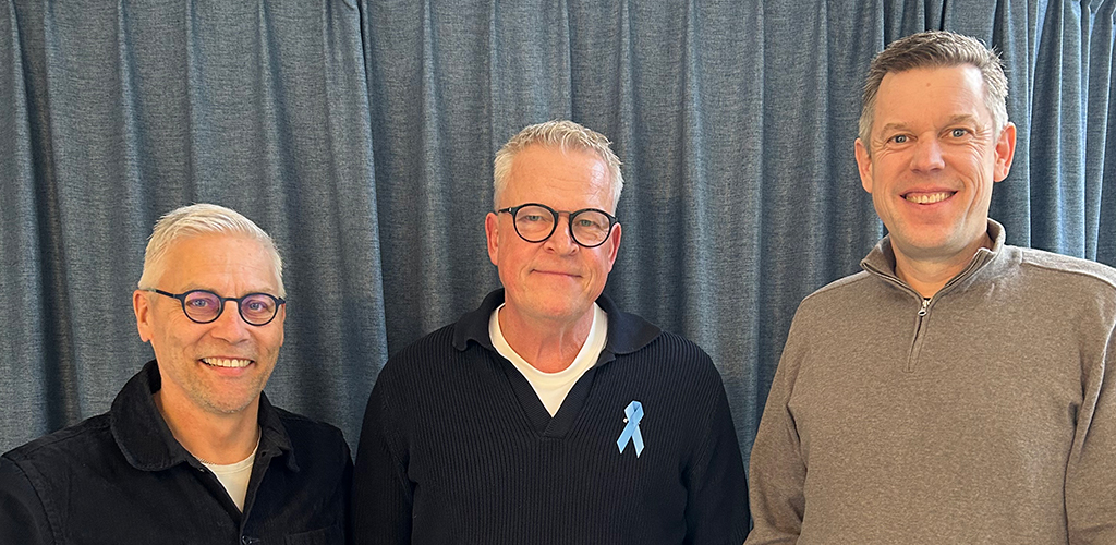 Tre glada medelålders män