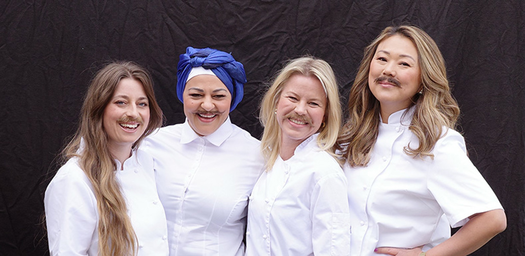 Fyra kvinnliga kockar i mustasch