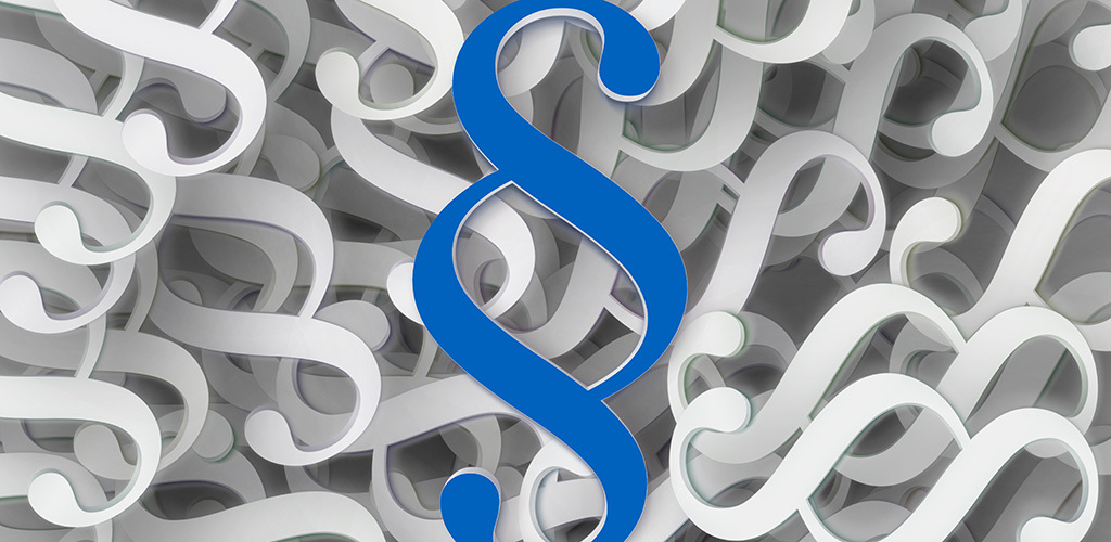 Närbild på stora paragrafsymboler